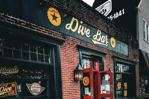 Dive Bar Winston-Salem arcade bar exterior on Burke Street